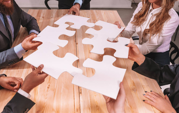 Business people connect puzzle pieces as integration and startup - Foto, Imagem