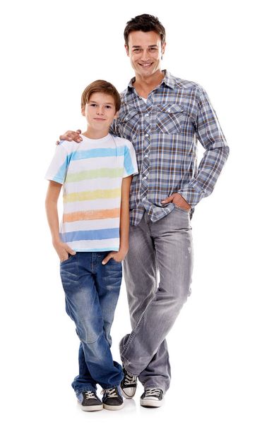 Real cool dudes...Full-length portrait of a father and son standing beside each other, isolated on white - Zdjęcie, obraz