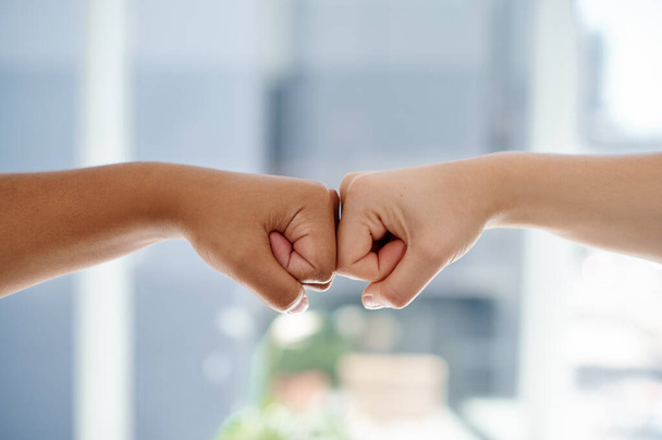 Fist bump, worker hands and motivation gesture of success, support and trust in a office. Friends, team building and collaboration hand sign with business people showing teamwork and solidarity. - Photo, Image