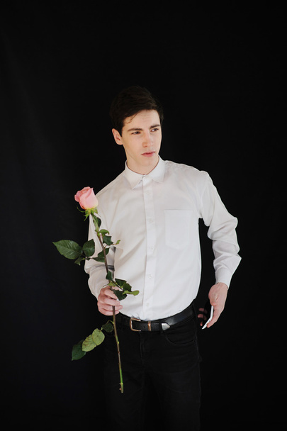 young man with a rose and telephone - Fotoğraf, Görsel