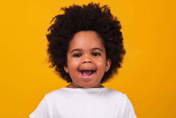 Closeup of happy little black girl smiling with space for text. - Fotografie, Obrázek