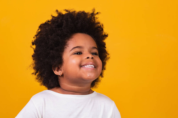 Closeup of happy little black girl smiling with space for text. - Photo, image