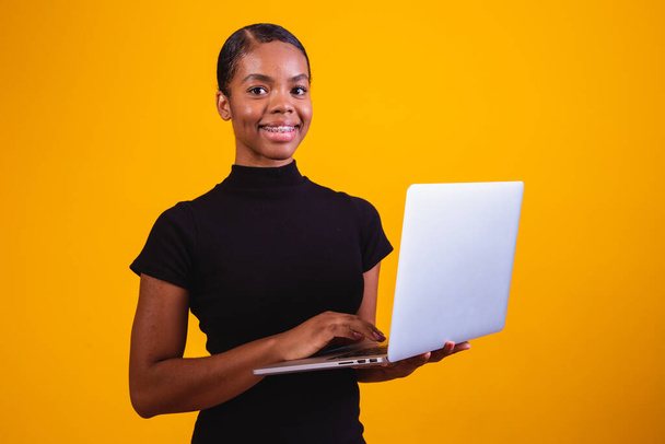 afro business woman working online with laptop computer. - 写真・画像