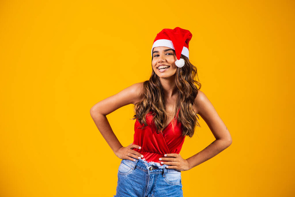 woman in new year clothes santa hat holiday christmas - Фото, изображение