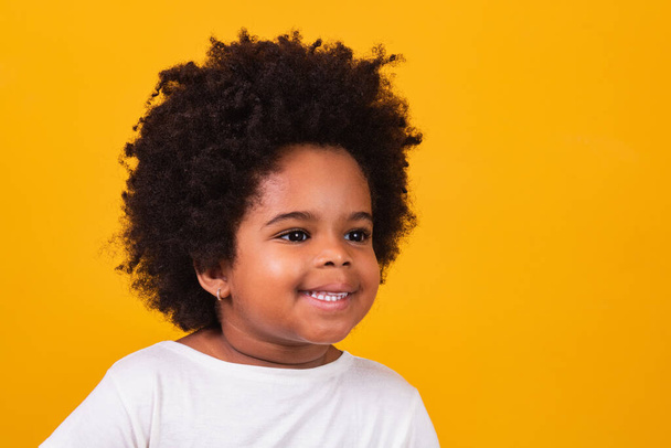 Closeup of happy little black girl smiling with space for text. - Zdjęcie, obraz