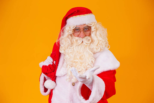 Santa Claus on yellow background. - Фото, зображення