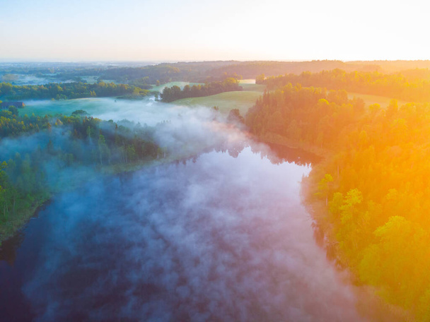 Majestic Morning: A Drone's Eye View of a Misty Lake in the Woods at Sunrise in Northern Europe - Fotó, kép