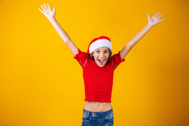 girl with arms up in christmas outfit - Zdjęcie, obraz