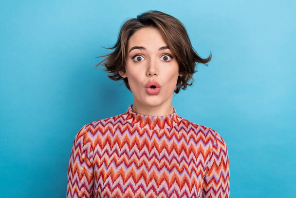 Photo portrait of attractive young woman impressed stare plump lips dressed stylish striped clothes isolated on blue color background. - Zdjęcie, obraz