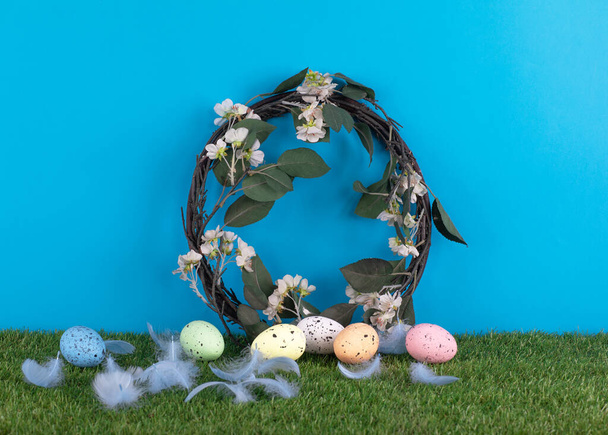 wreath and easter eggs on the grass - Photo, Image