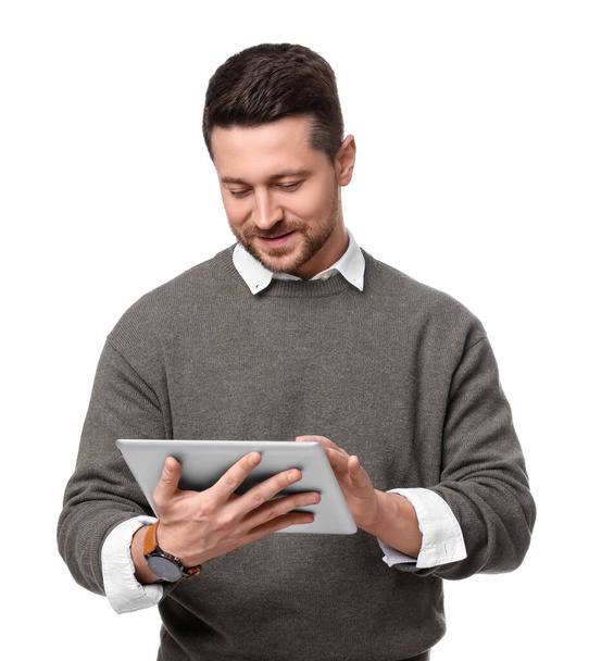 Handsome bearded businessman using tablet on white background - Foto, afbeelding
