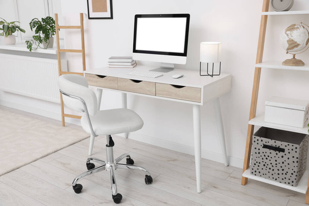 Workplace with comfortable office chair indoors. Interior design - Φωτογραφία, εικόνα