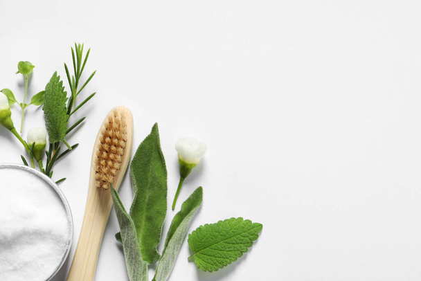 Flat lay composition with toothbrush and herbs on white background. Space for text - Valokuva, kuva