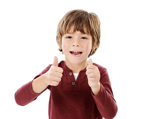 Thats the stuff. Studio shot of a cute little boy giving you thumbs up against a white background - Фото, зображення