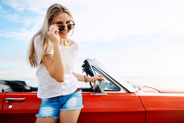 Give me a summer road trip and Ill be happy. a happy young woman enjoying a summers road trip - Photo, Image