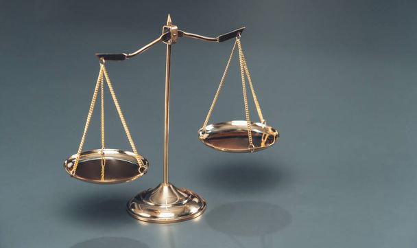 Shiny golden balanced scale in courtroom background as concept justice and a common legal symbol. Scale balance for righteous and equality judgment by lawyer and attorney. Equilibrium - Photo, image