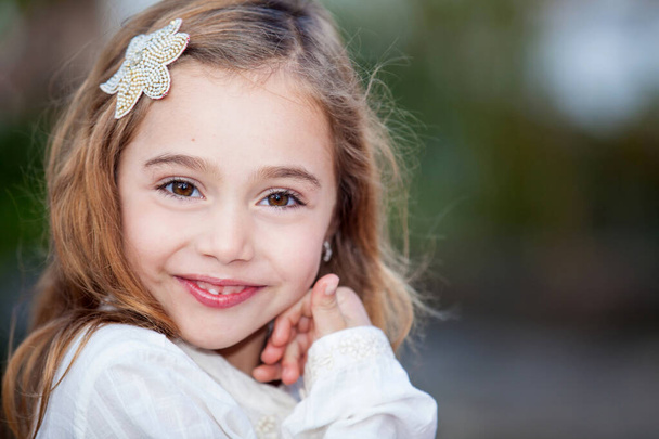 Sweet six years old blonde girl outdoors - Zdjęcie, obraz