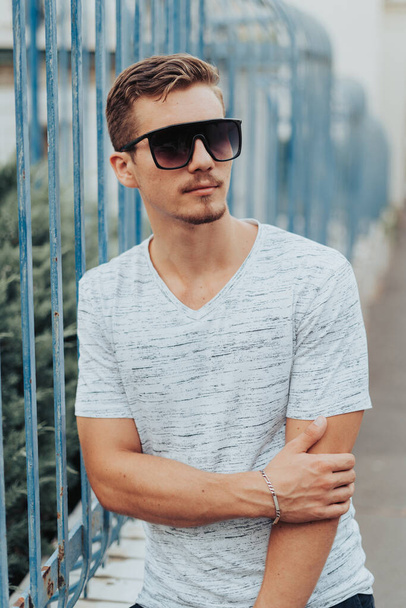 Portrait of Young Man with Sunglasses. - Foto, afbeelding