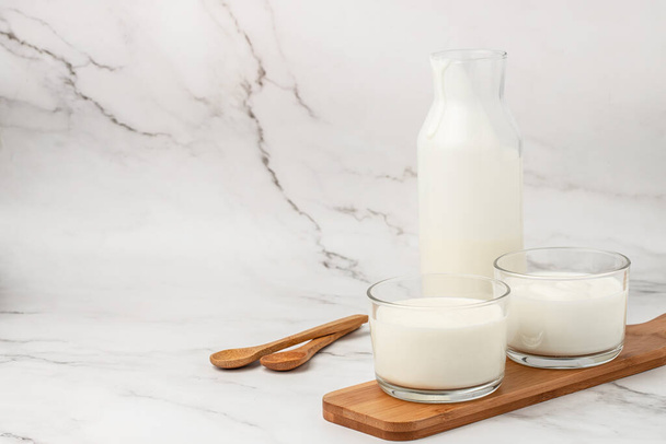 lactose free yogurt, kefir, fermented milk on a light background. Healthy, clean eating. Vegan or gluten free diet, - Photo, Image
