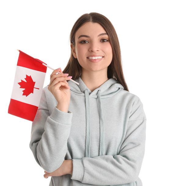 Young woman with flag of Canada on white background - Фото, зображення