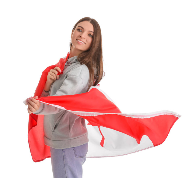 Young woman with flag of Canada on white background - Valokuva, kuva