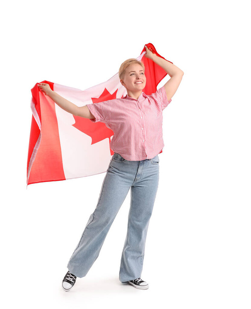 白地にカナダの旗を持つ若い女性 - 写真・画像
