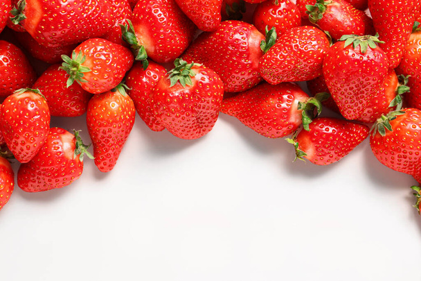 Fresh strawberries on white background - Fotó, kép