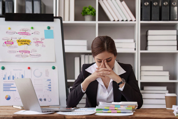 Deadline with young business woman feeling stressed concept. Business woman working at office, business finance concept. - Photo, Image