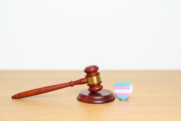 Transgender Day, LGBTQ Law and Pride month concepts. gavel justice hammer with blue, pink and white heart shape for Lesbian, Gay, Bisexual, Queer, Intersex - Photo, Image