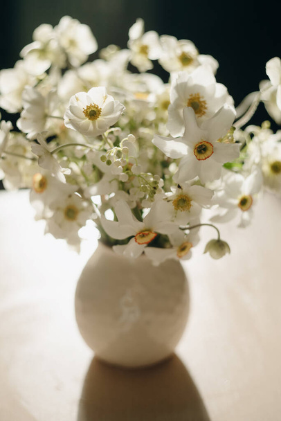 white spring flowers in sunlight, bridal bouquet - Фото, изображение