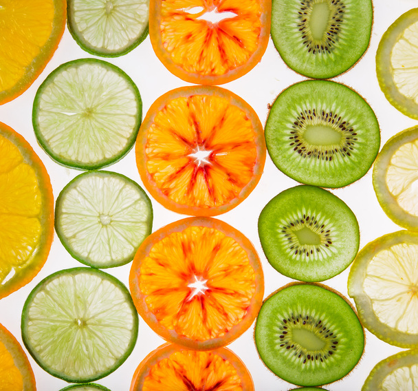 Sliced fruits background - Foto, afbeelding