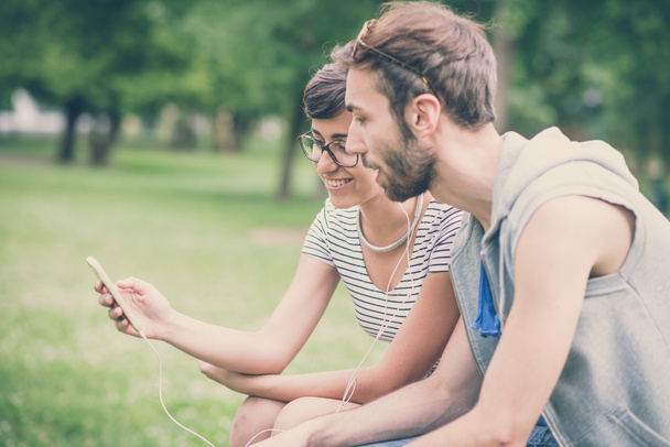Man and woman using smartphone - Photo, image