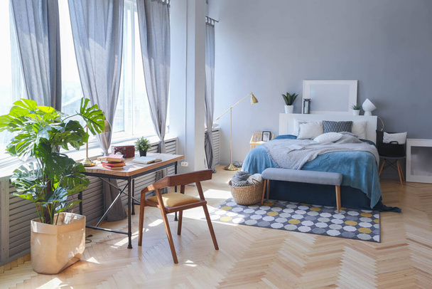 elegant creative modern trendy interior of a spacious open plan Scandinavian style studio with seating and sleeping areas - Foto, Bild