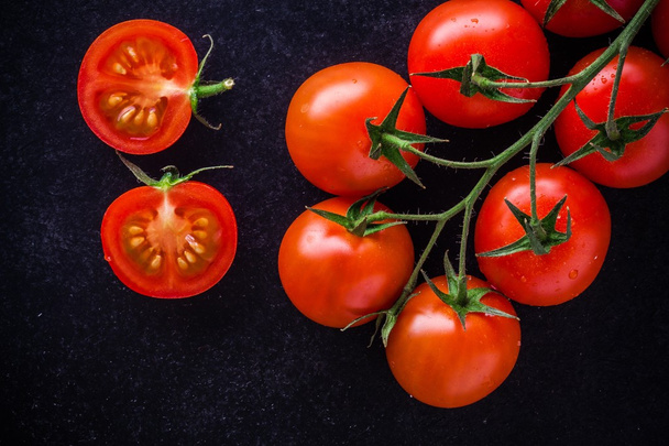 a bunch of fresh organic cherry tomatoes  - Фото, изображение