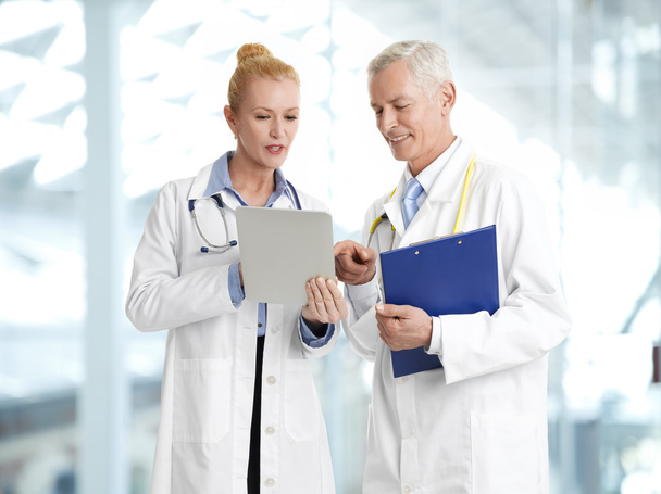 Doctors with tablet and clipboard - Φωτογραφία, εικόνα