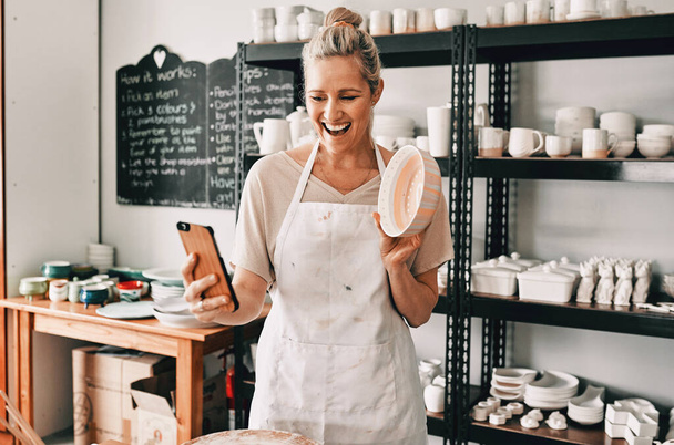 Happy woman, pottery and selfie in small business for social media, advertising or vlog at store. Female person or retail owner smiling with clay bowl for photo or online post on mobile smartphone. - Photo, Image