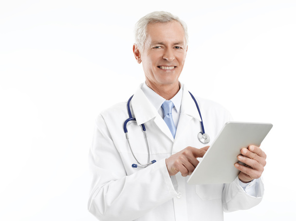 Male doctor with tablet - Фото, изображение