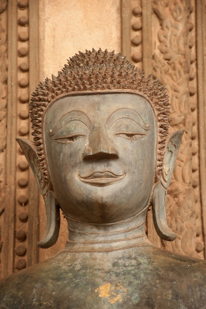 Ancient Buddha on the  Church in Hor Phakeo Temple, Laos . - Photo, image