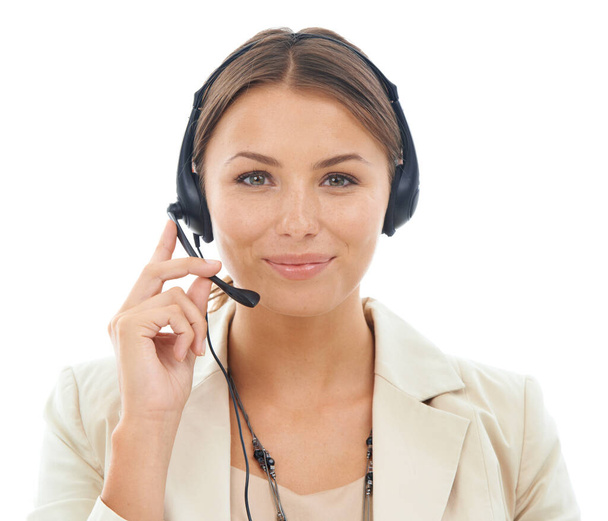 How can I be of service. A close-up studio shot of an attractive young receptionist wearing a headset isolated on a white background - Foto, immagini