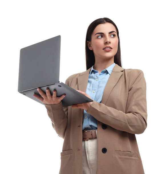 Beautiful businesswoman with laptop on white background, low angle view - Foto, afbeelding
