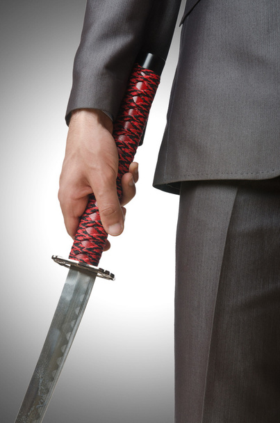Empresario con espada
 - Foto, imagen