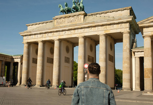 Tourist visiting Brandenburg Gate in Berlin, Germany   - Φωτογραφία, εικόνα