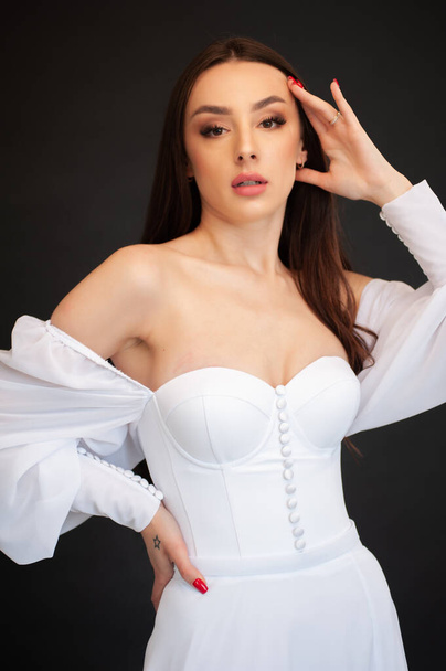 sexy brunette woman in white lingerie and white shirt  - Zdjęcie, obraz