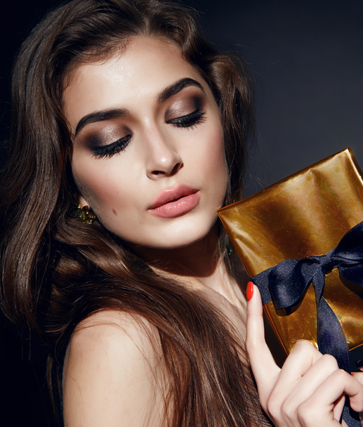 Beautiful sexy woman brunett evening makeup with box present - Photo, Image