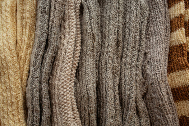knitted hand made gloves and socks made of woolen thread - Valokuva, kuva