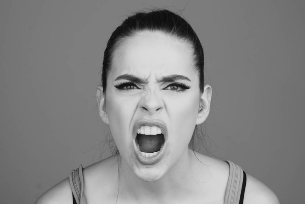 Screaming, hate, rage. Pensive woman feeling furious mad and crazy stress. Sad and angry face. Shouting mouth, screaming face - Foto, Imagen