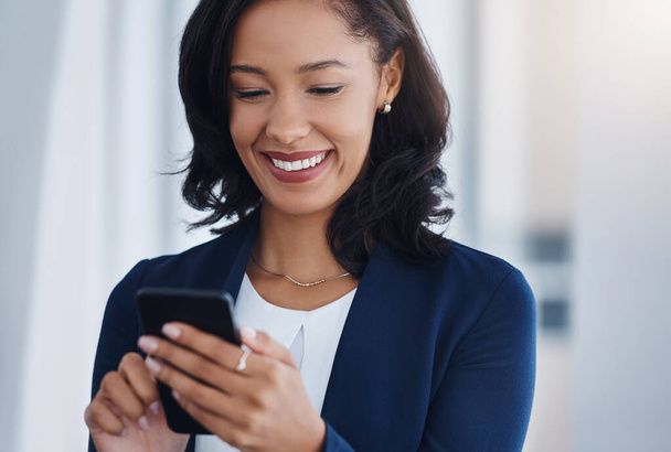 Happy, employee or woman with a cellphone, mobile app or connection with social media, chatting or check emails. Female person, consultant or entrepreneur with smartphone or search website for info. - Foto, imagen