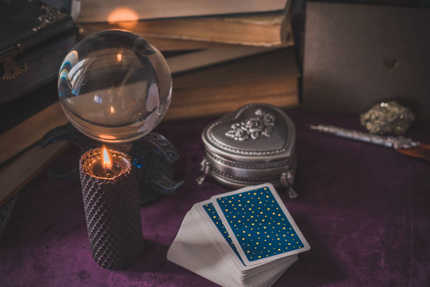 Tarot cards and candles, witch magic bottles . Wicca, esoteric, divination and occult background with vintage magic objects for mystic rituals - Fotografie, Obrázek