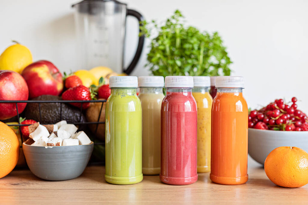 Healthy fresh fruit and vegetable smoothies with assorted ingredients of various colors and tastes. Superfood detox and diet food concept - Foto, immagini