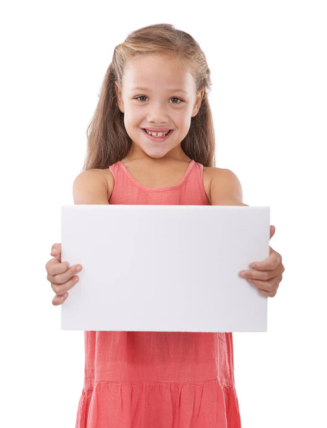 All kids will love this. Studio shot of a young girl holding a blank sign for copyspace - Foto, Imagen